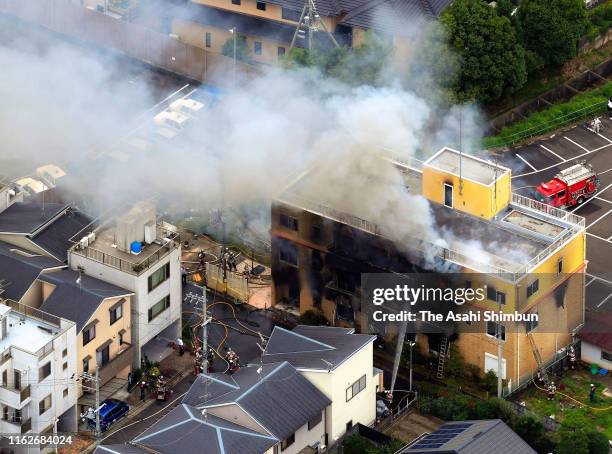 In this aerial image, fire breaks out at a studio of Kyoto Animation Co. On July 18, 2019 in Kyoto, Japan. Police suspect an arsonist set a fire that...