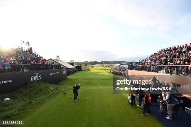 Darren Clarke of Ireland hits the opening tee shot on the 1st hole during the first round of the 148th Open Championship held on the Dunluce Links at...