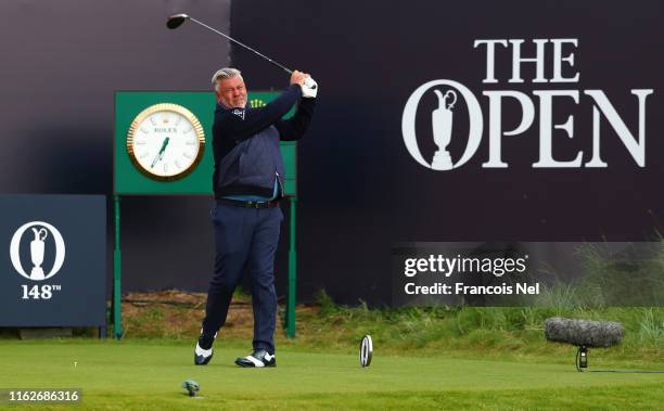 Darren Clarke of Northern Ireland plays the opening tee shot off the first tee during the first round of the 148th Open Championship held on the...