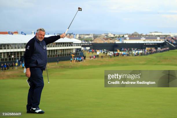 Darren Clarke of the Northern Ireland celebrates his birdie on the first green during the first round of the 148th Open Championship held on the...