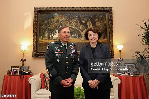 Army Gen. David Petraeus , commander of U.S. And ISAF forces in Afghanistan, poses for photographs with Senate Select Committee on Intelligence...