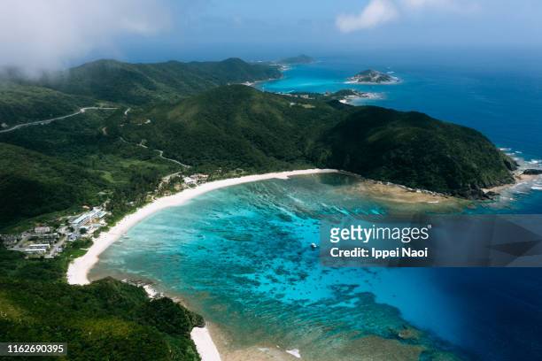 aerial view of tropical bay, tokashiki island, okinawa, japan - okinawa islands stock pictures, royalty-free photos & images