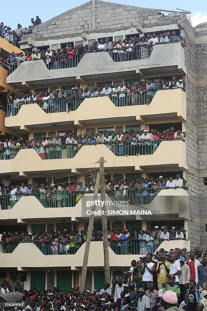 A crowd watches rescue efforts after a b