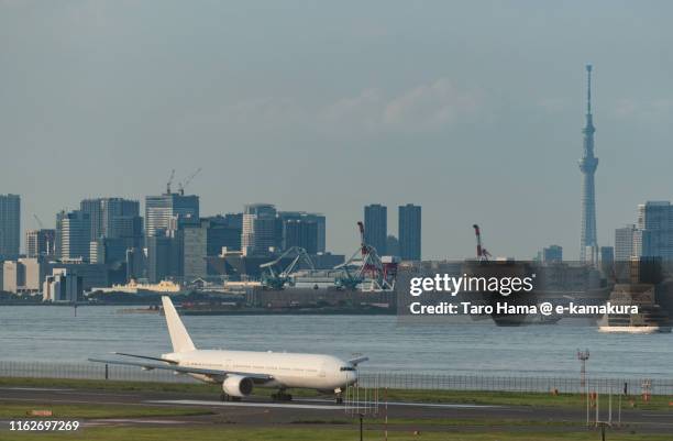 the airplane taking off tokyo haneda international airport in japan - tokyo international airport ストックフォトと画像