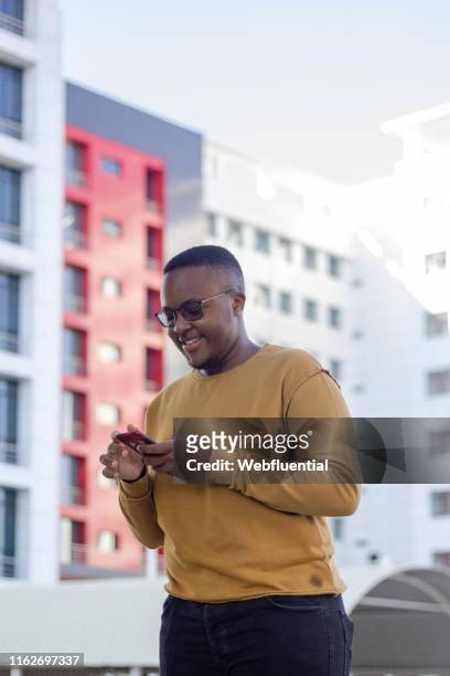 Young black man using a phone