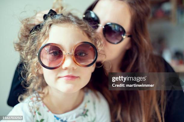 mother and daughter with big sunglasses - fashionable mom stock pictures, royalty-free photos & images