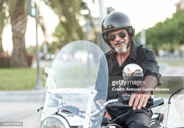 classic old sidecar senior biker in city bulevar - old motorcycles bildbanksfoton och bilder
