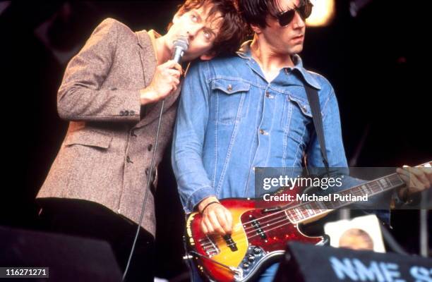 Jarvis Cocker and Steve Mackey of Pulp perform on stage at Glastonbury Festival, June 1994.