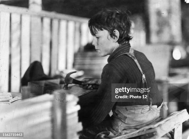 Boy making Melon Baskets, A Basket Factory, Evansville, Ind. Location: Evansville, Indiana.