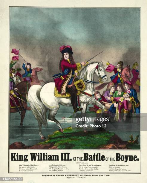 King William III at the battle of the Boyne on horseback leading troops into battle. 1874 illustration. The Battle of the Boyne in 1690 between rival...