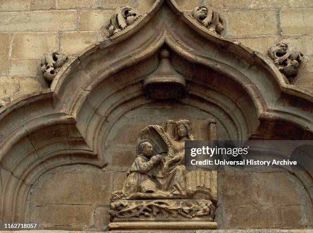 Spain, Community of Madrid, Torrelaguna. Church of la Magdalena. Gothic style. Facade, architectural detail. Tympanum decorated with sculptoric...