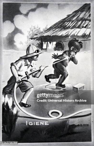 Racist Italian Fascist era poster depicting an African being washed by an Italian colonial official with the word Igiene appearing adjacent. Circa...