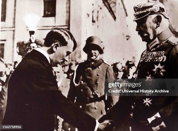 President Hindenburg throats during a national party day at Chancellor Adolf Hitler.