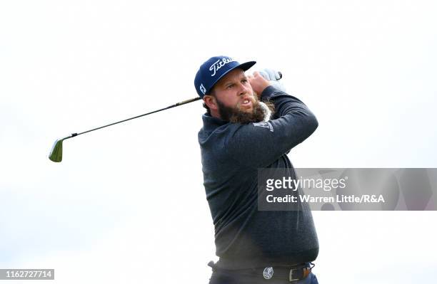 Andrew Johnston of England plays his shot from the sixth tee during the first round of the 148th Open Championship held on the Dunluce Links at Royal...