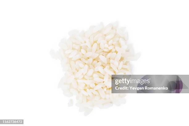 white rice isolated on white background - rijst stockfoto's en -beelden