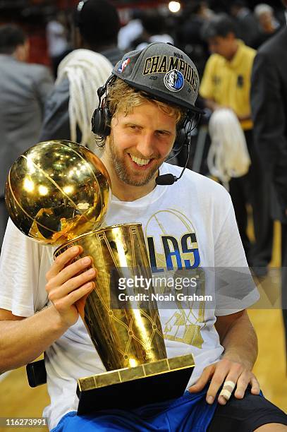 Dallas Mavericks power forward Dirk Nowitzki is seen with the trophy during Game Six of the 2011 NBA Finals against the Miami Heat on June 12, 2011...