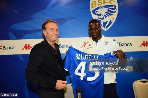 President of Brescia Calcio Massimo Cellino and Mario Balotelli show the Brescia Calcio jersey during Brescia Calcio Unveils New Signing Mario...