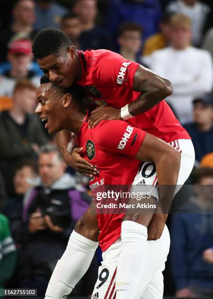 Anthony Martial of Manchester United celebrates scoring the opening goal with Marcus Rashford during the Premier League match between Wolverhampton...