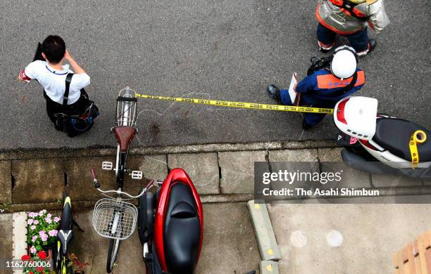 The place where an arson suspect fell has been marked and secured after a fire at a studio of Kyoto Animation Co. On July 18, 2019 in Kyoto, Japan....