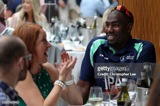 Alex Tudor talks to guests during the PCA Summer Garden Party at The Hurlingham Club on July 18, 2019 in London, England.