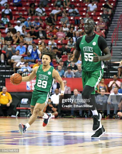 Carsen Edwards of the Boston Celtics brings the ball up the court alongside teammate Tacko Fall during a game against the Memphis Grizzlies during...