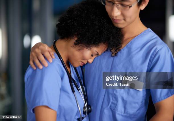 doctors mourn and grieve too - upset coworker stock pictures, royalty-free photos & images