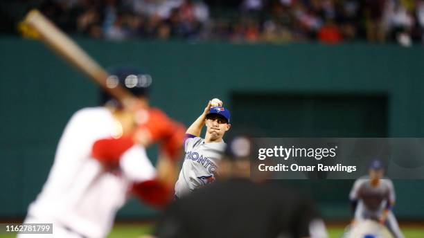 Starting pitcher Aaron Sanchez of the Toronto Blue Jays pitches in the bottom of the first inning of the game against the Boston Red Sox at Fenway...