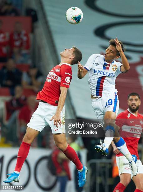Roman Zobnin of FC Spartak Moscow and Takuma Nishimura of PFC CSKA Moscow vie for the ball during the Russian Football League match between FC...