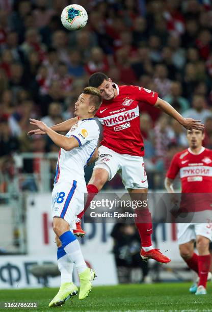 Ayaz Guliyev of FC Spartak Moscow and Ivan Oblyakov of PFC CSKA Moscow vie for the ball during the Russian Football League match between FC Spartak...