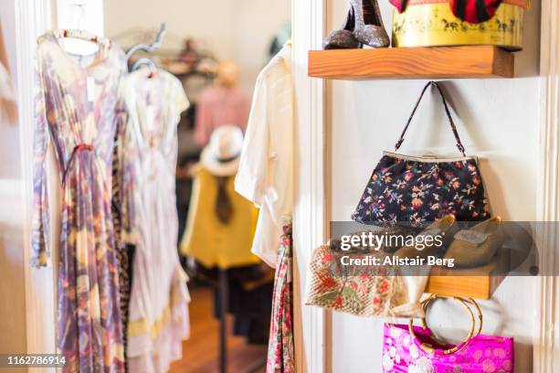 detail of interior of a vintage clothes shop - retro style shopping stock pictures, royalty-free photos & images