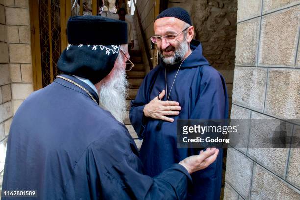 Orthodox priest and catholic monk in Jerusalem, Israel.