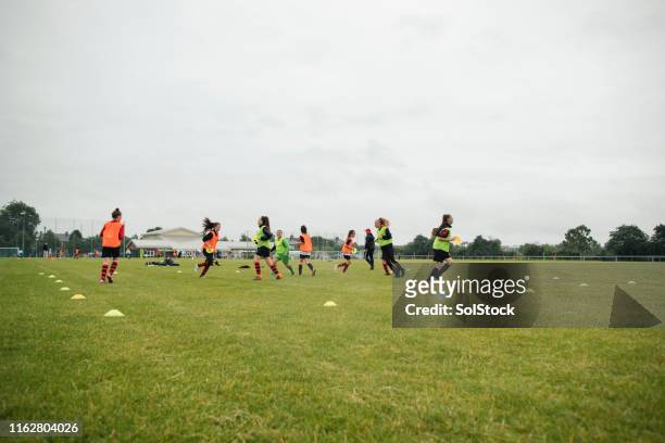female football team practice - sports drill stock pictures, royalty-free photos & images