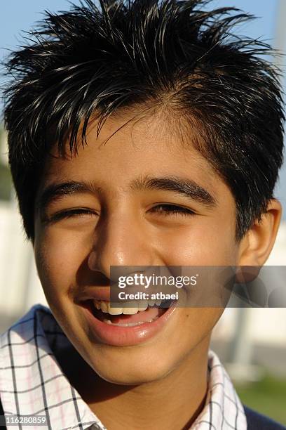 happy young boy smiling on sunny day - iranian people stock pictures, royalty-free photos & images