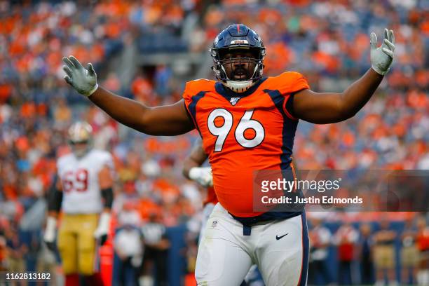 Defensive tackle Shelby Harris of the Denver Broncos celebrates after making a tackle for a loss during the first quarter of a preseason game against...