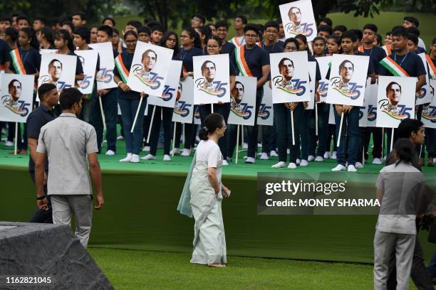 Sonia Gandhi , Congress Party interim president and wife of former Indian prime minister Rajiv Gandhi, greets children during a memorial ceremony to...