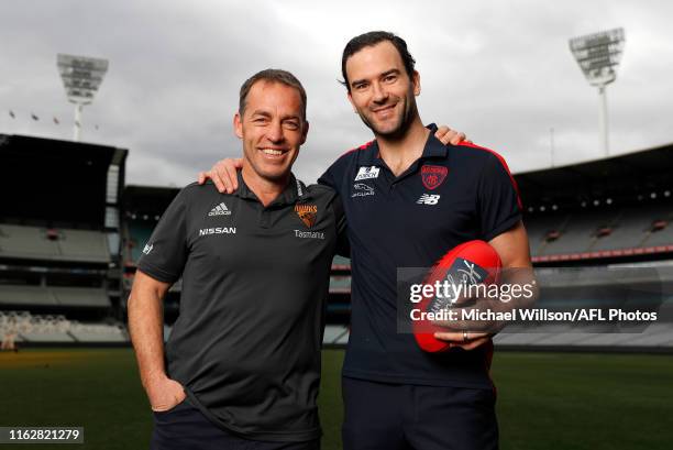 Alastair Clarkson, Senior Coach of the Hawks and Jordan Lewis pose for a photograph after announcing his AFL retirement during a press conference at...