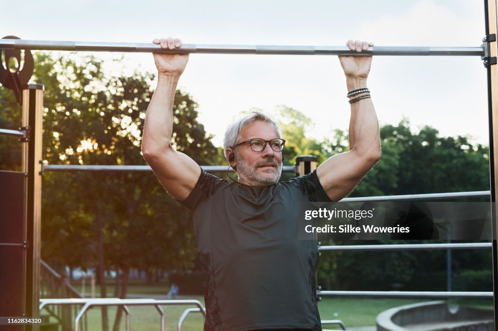 Portrait of an active senior man doing exercise in the city of Berlin