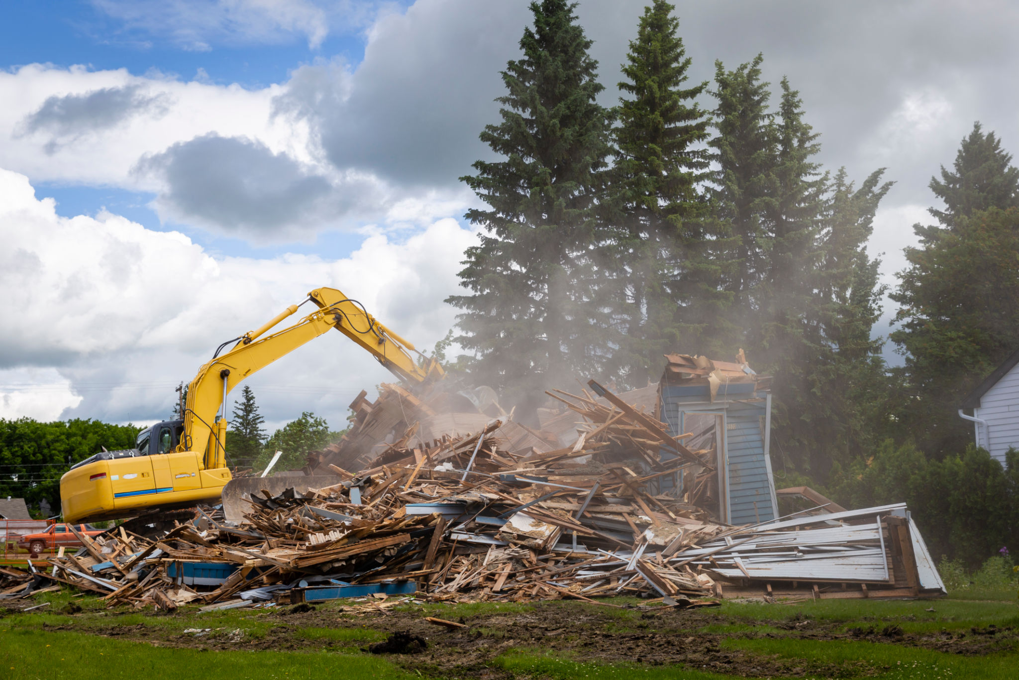 heavy duty machine demolishing a wood building heavy duty machine demolishing a wood building