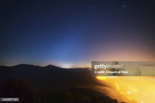 königswinter mountains, town in the fog and starry night - zodiacal light stock pictures, royalty-free photos & images