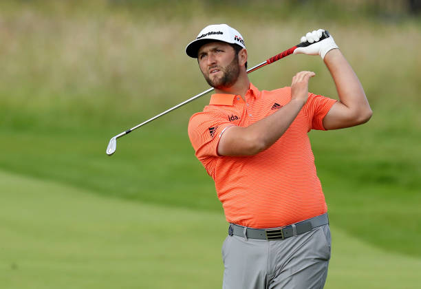 Jon Rahm of Spain plays his second shot on the 18th hole during the first round of the 148th Open Championship held on the Dunluce Links at Royal...