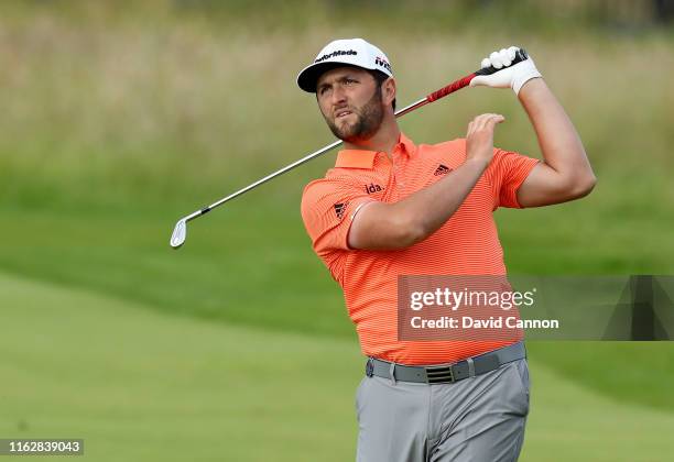 Jon Rahm of Spain plays his second shot on the 18th hole during the first round of the 148th Open Championship held on the Dunluce Links at Royal...