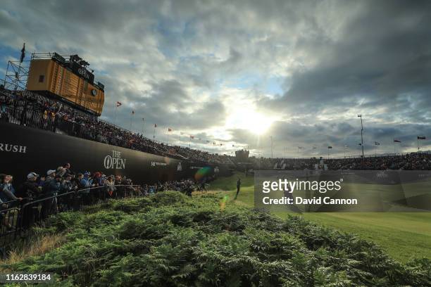 Tiger Woods of the United States plays his third shot on the 18th hole during the first round of the 148th Open Championship held on the Dunluce...
