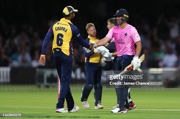 De Villiers of Middlesex shakes hands with Varun Chopra of the Essex Eagles after the Vitality Blast match between Middlesex and Essex Eagles at...