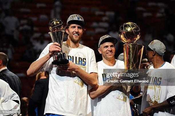 Dirk Nowitzki of the Mavericks holds the championship trophy after  defeating the Heat during Game 6 of the NBA Finals at the AmericanAirlines  Arena in Miami, Florida, Sunday, June 12, 2011. The