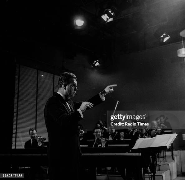 Neldon Riddle Composer Nelson Riddle conducting an orchestra, June 1962. News Photo ...