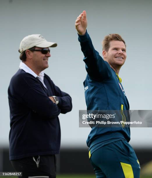 Steve Smith of Australia looks on as he stands with former captain Mark Taylor on the field before the third Specsavers test match between England...