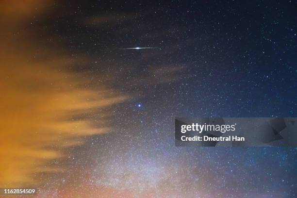 shooting star and cloud with milky way - the north star stock pictures, royalty-free photos & images