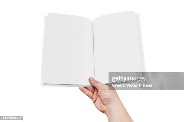 mock up of the book isolate in hand man closeup, on a white background. concept on the topic of education - back to school. - white magazine cover stock pictures, royalty-free photos & images