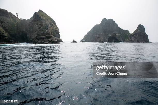 Dongdo , left, and Seodo, right, of the Dokdo Islets, are seen from a ferry on August 18 South Korea. Since the trade war between South Korea and...