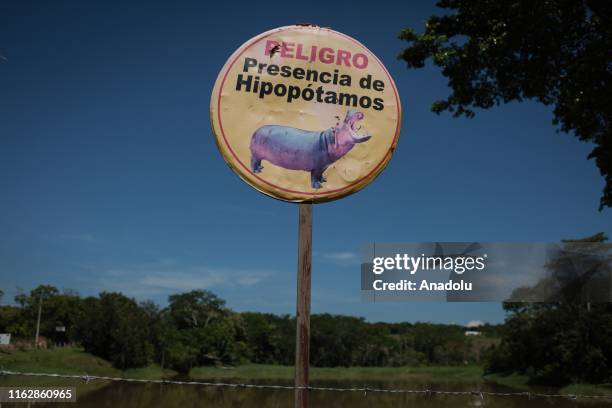 Warning sign for hippopotamuses near Hacienda Naples in Doradal, Colombia, August 18, 2019. Pablo Escobar owned Hacienda Naples where he set up his...